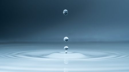 Close-up,Of,A,Water,Drop,And,Splash,Background,,Small,Impact